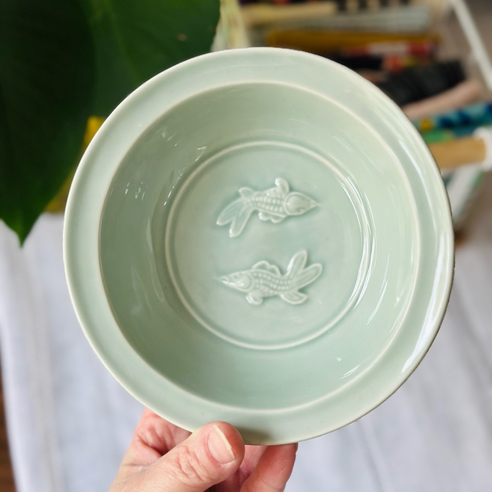 Vintage MMA replica of a Chinese Longquan celadon 'twin fish' bowl.